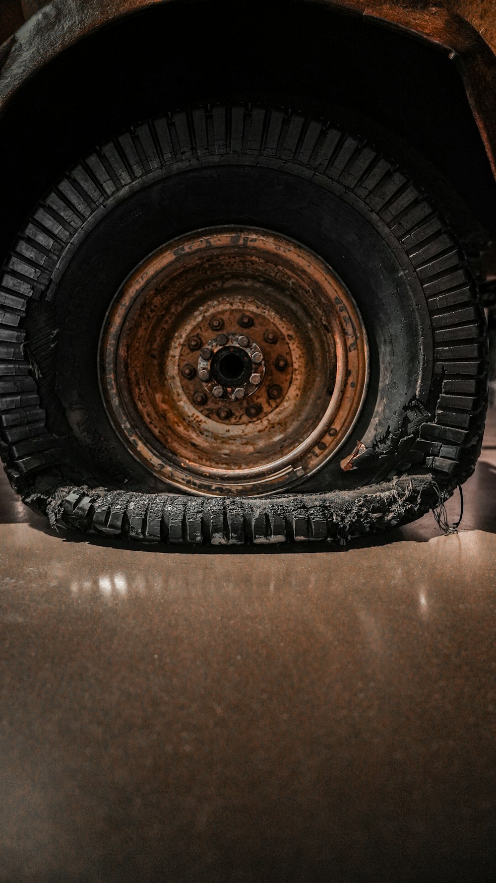 a rusted tire of an old car