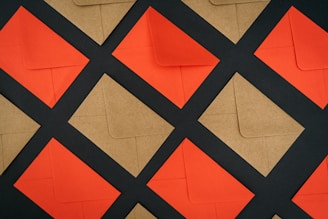 a close up of a piece of brown paper with black and orange squares
