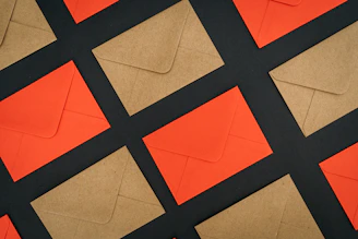 a close up of a piece of paper with orange and black squares