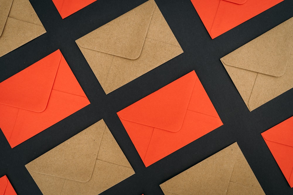 a close up of a piece of paper with orange and black squares