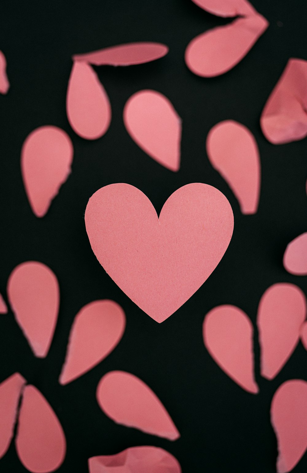a heart surrounded by pink paper hearts