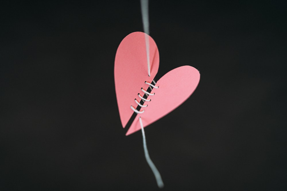 a paper heart hanging from a string