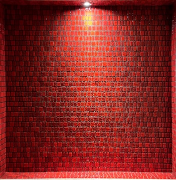 Bright kitchen wall featuring glossy ceramic tiles arranged in a neat, stylish pattern.