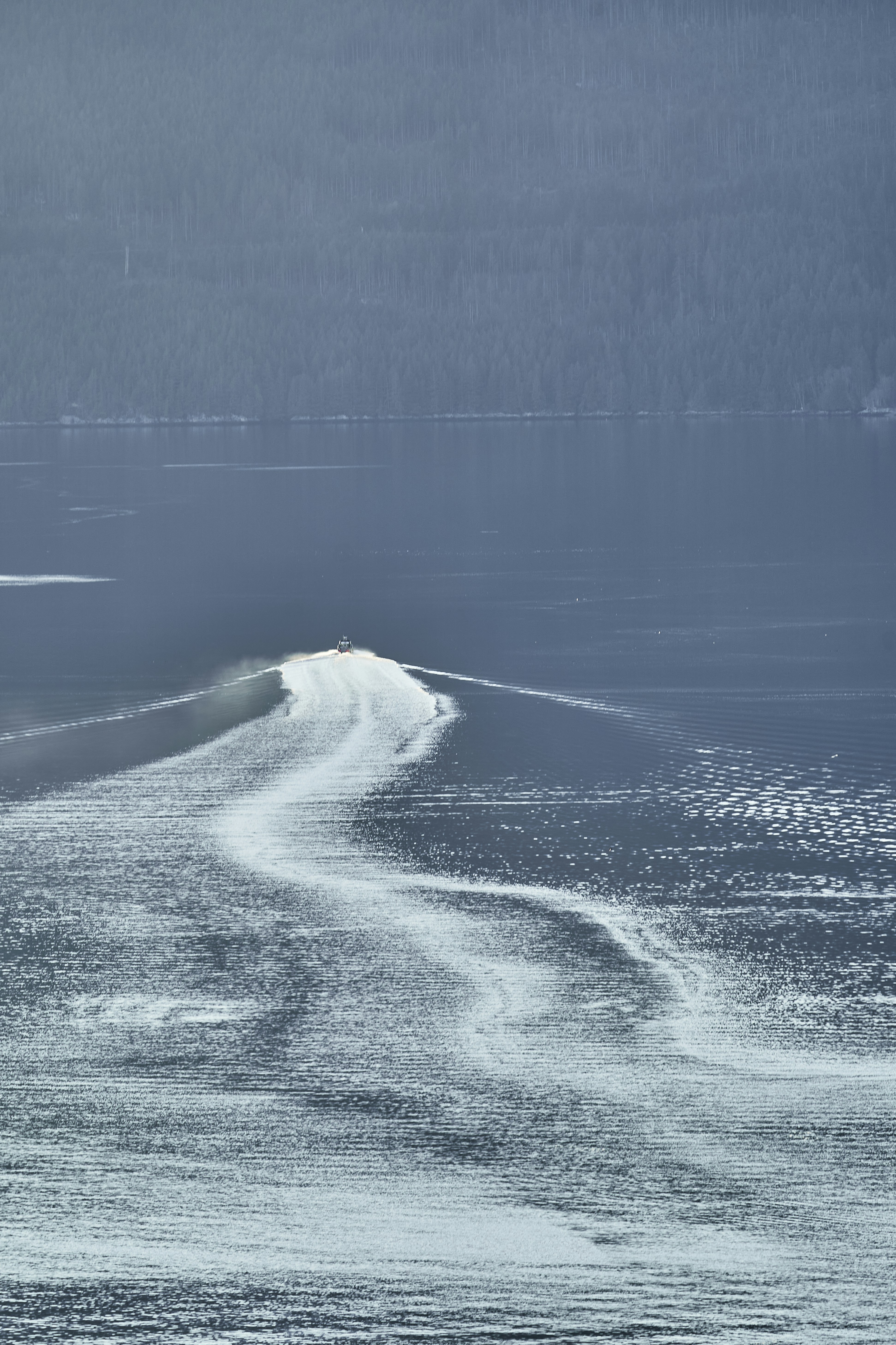 a person riding a surfboard on a body of water