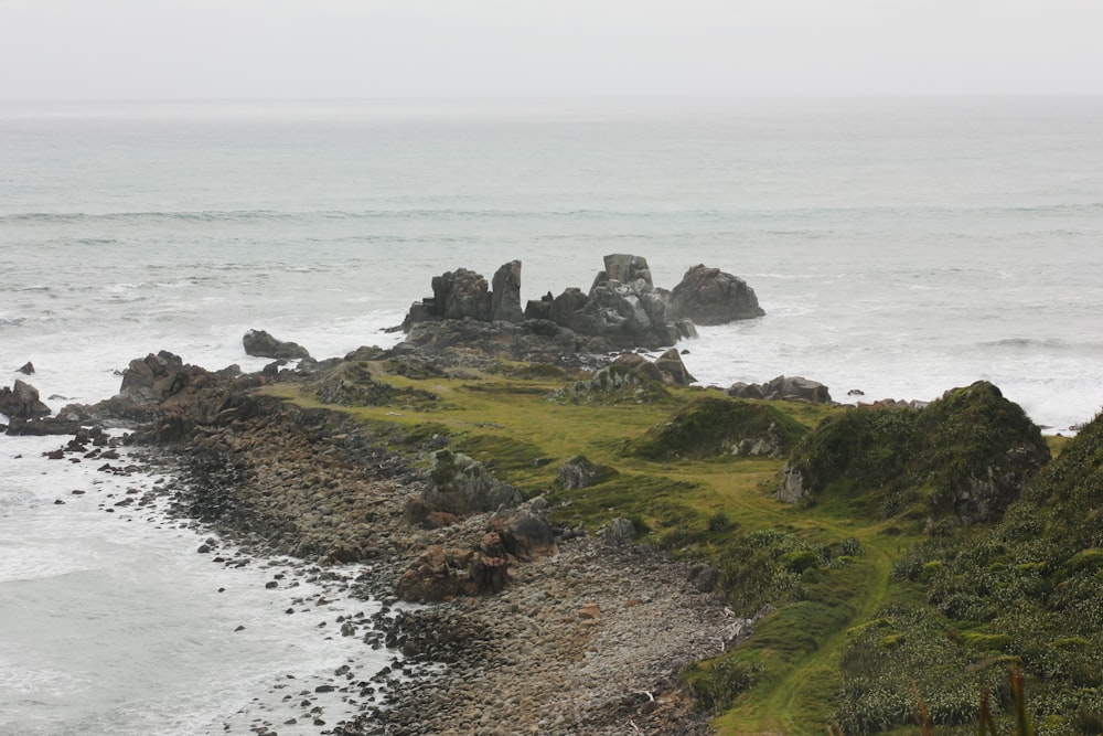 a view of the ocean from a rocky cliff