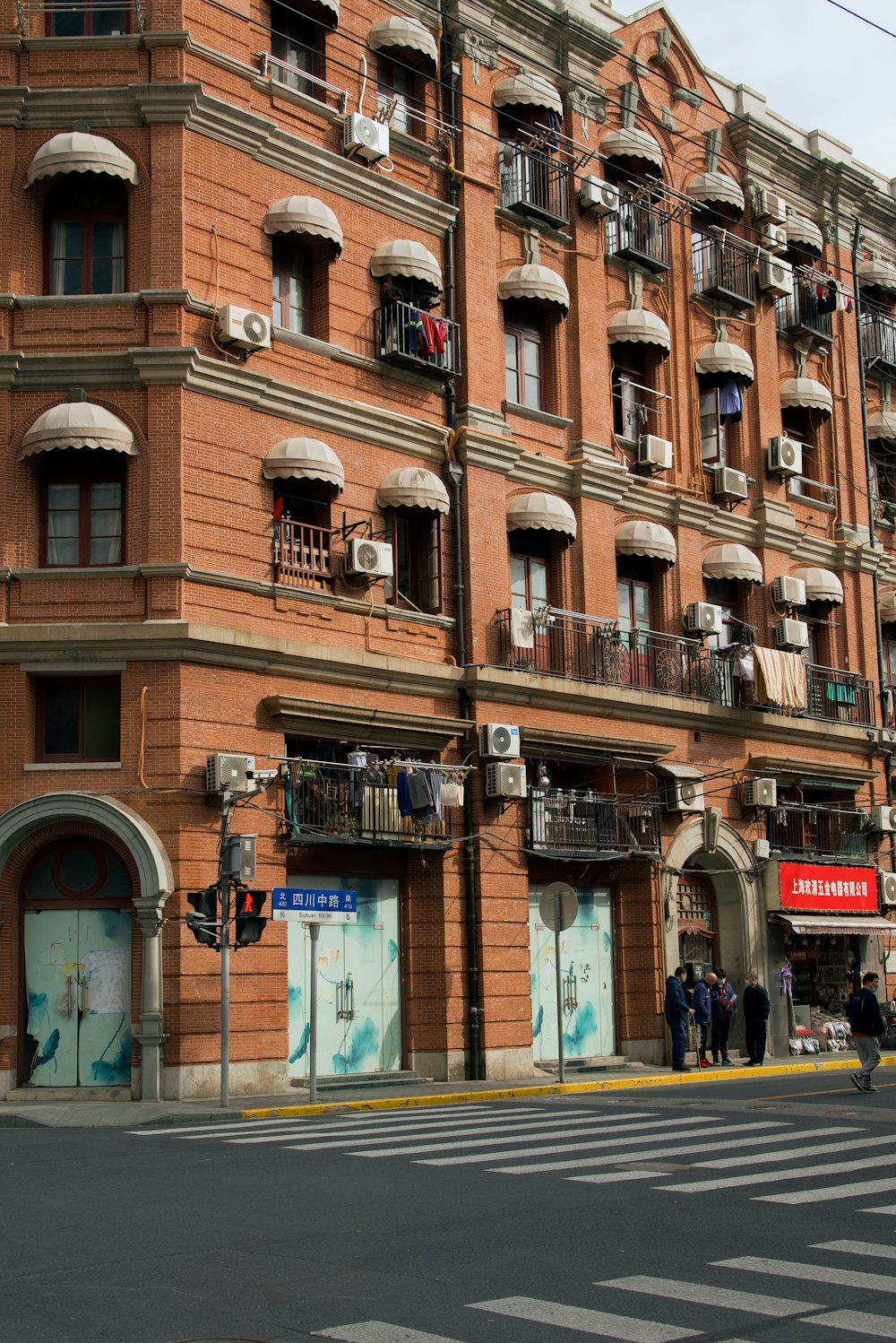 a large brick building with balconies and balconies