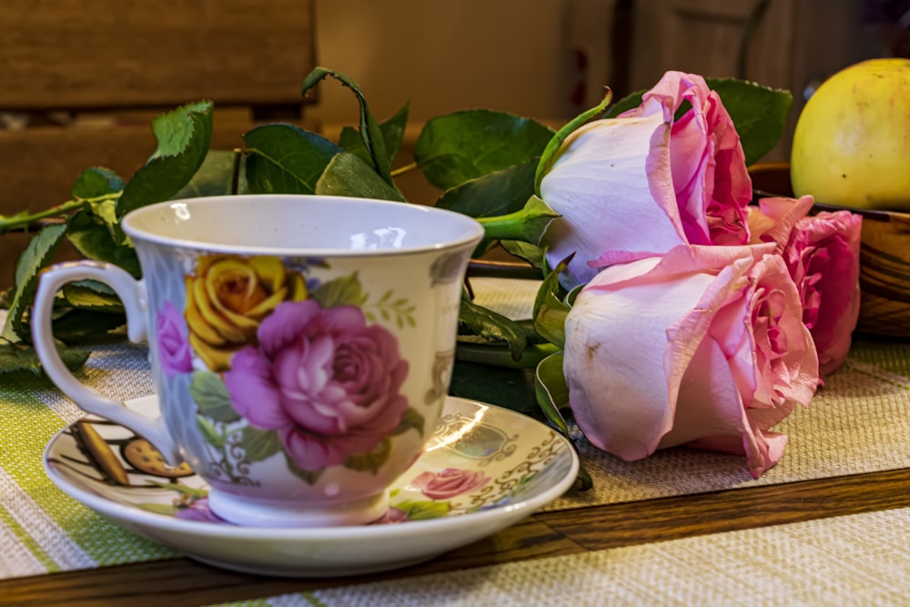 a cup and saucer sitting on a table
