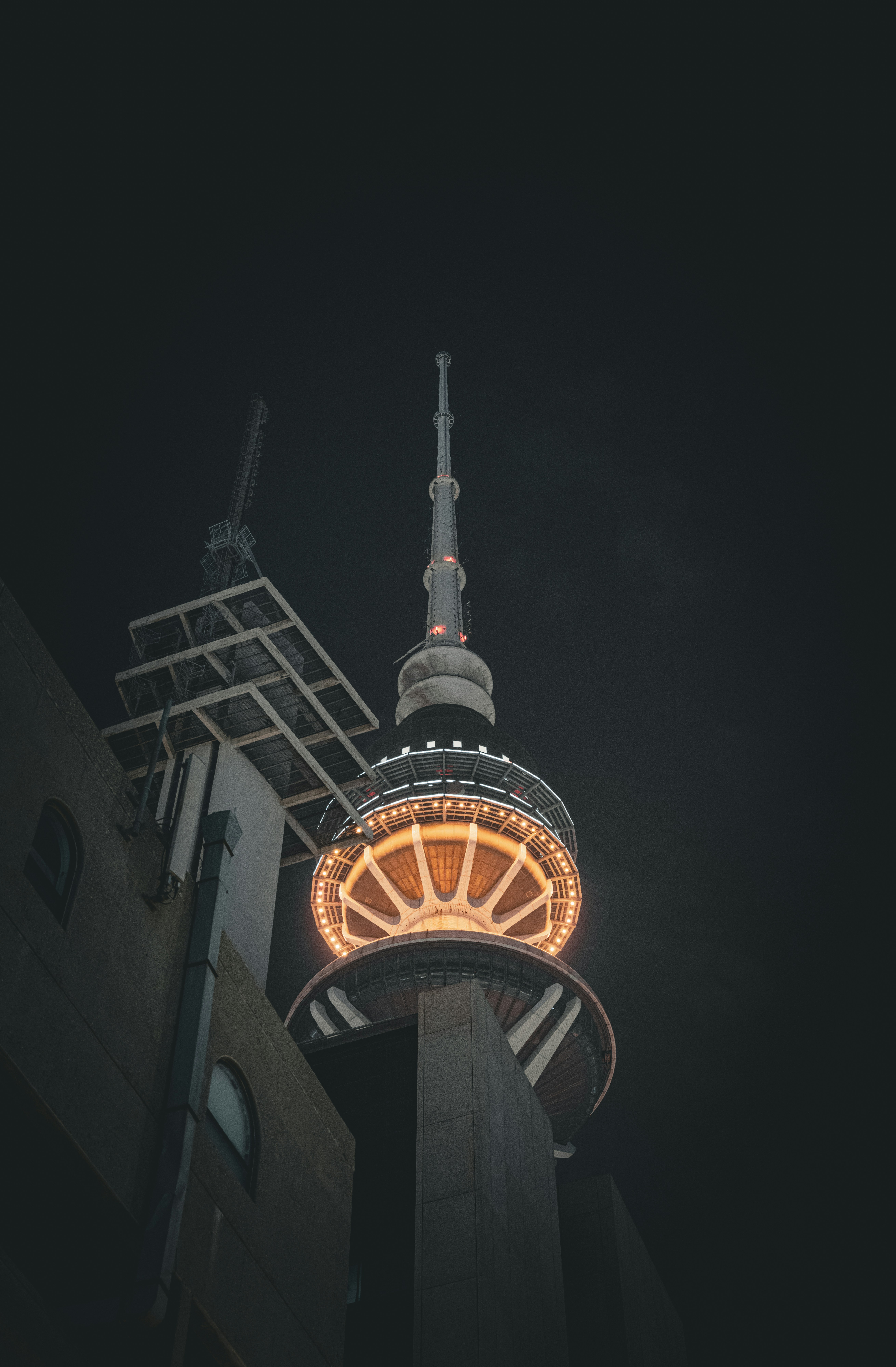 a tall tower with a clock on it's side