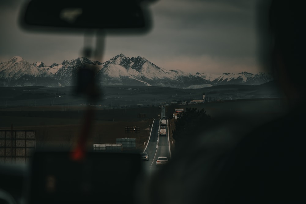 a view of a mountain range from a bus window