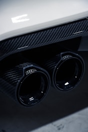 a close up of a car's exhaust pipe