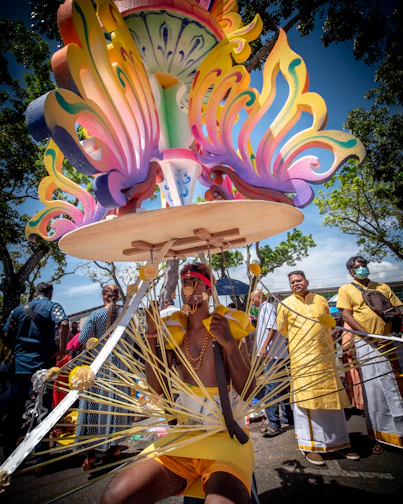 a man in a yellow swimsuit with a large clock on his head