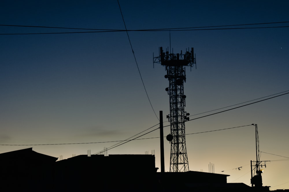 a tower with a cell phone on top of it