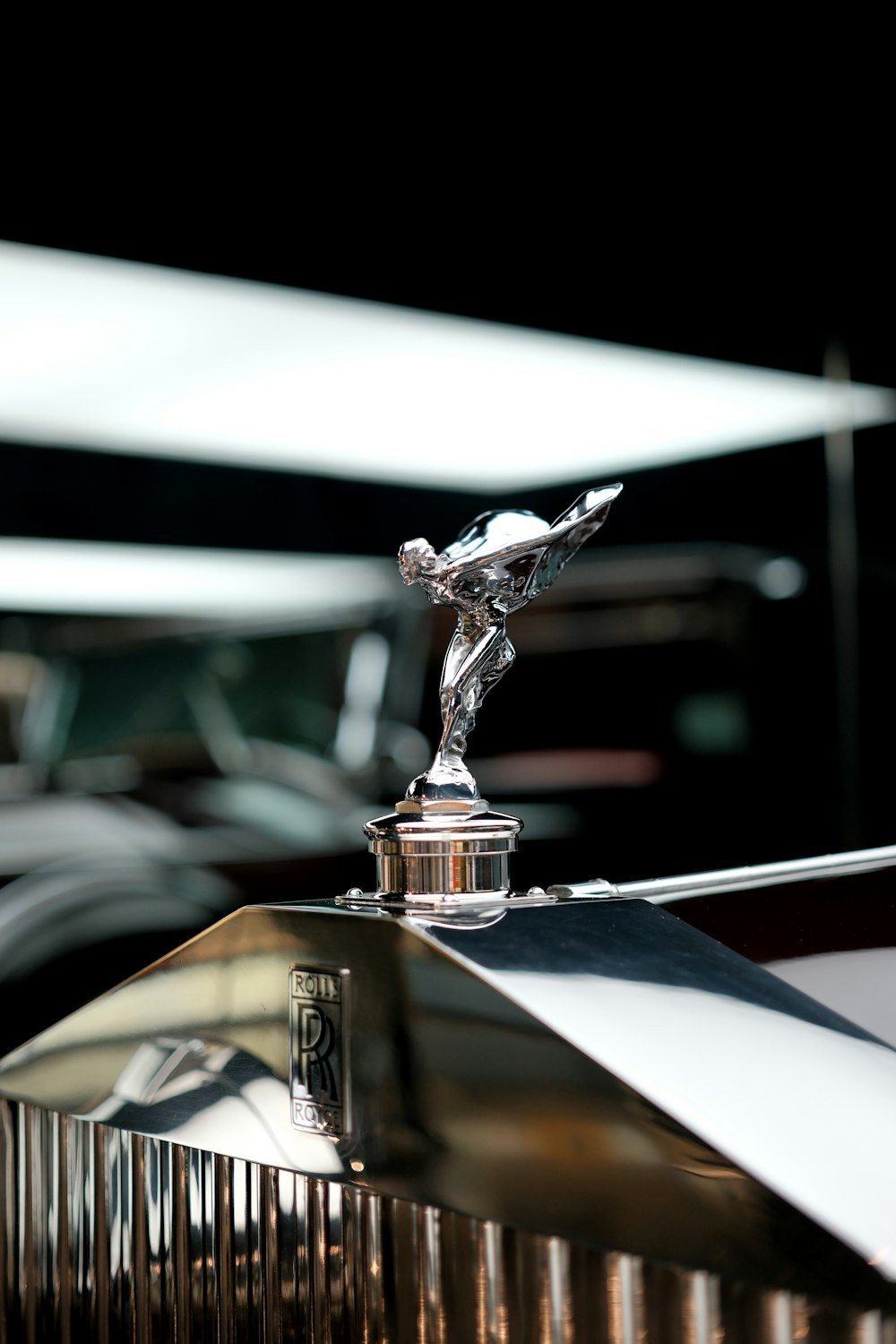 the hood ornament of a classic car