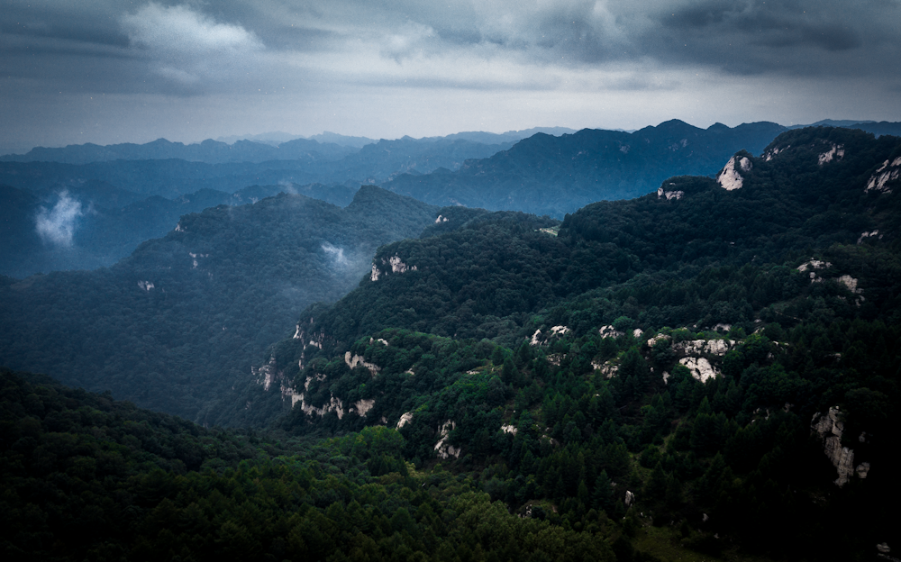 a view of the mountains from a high point of view