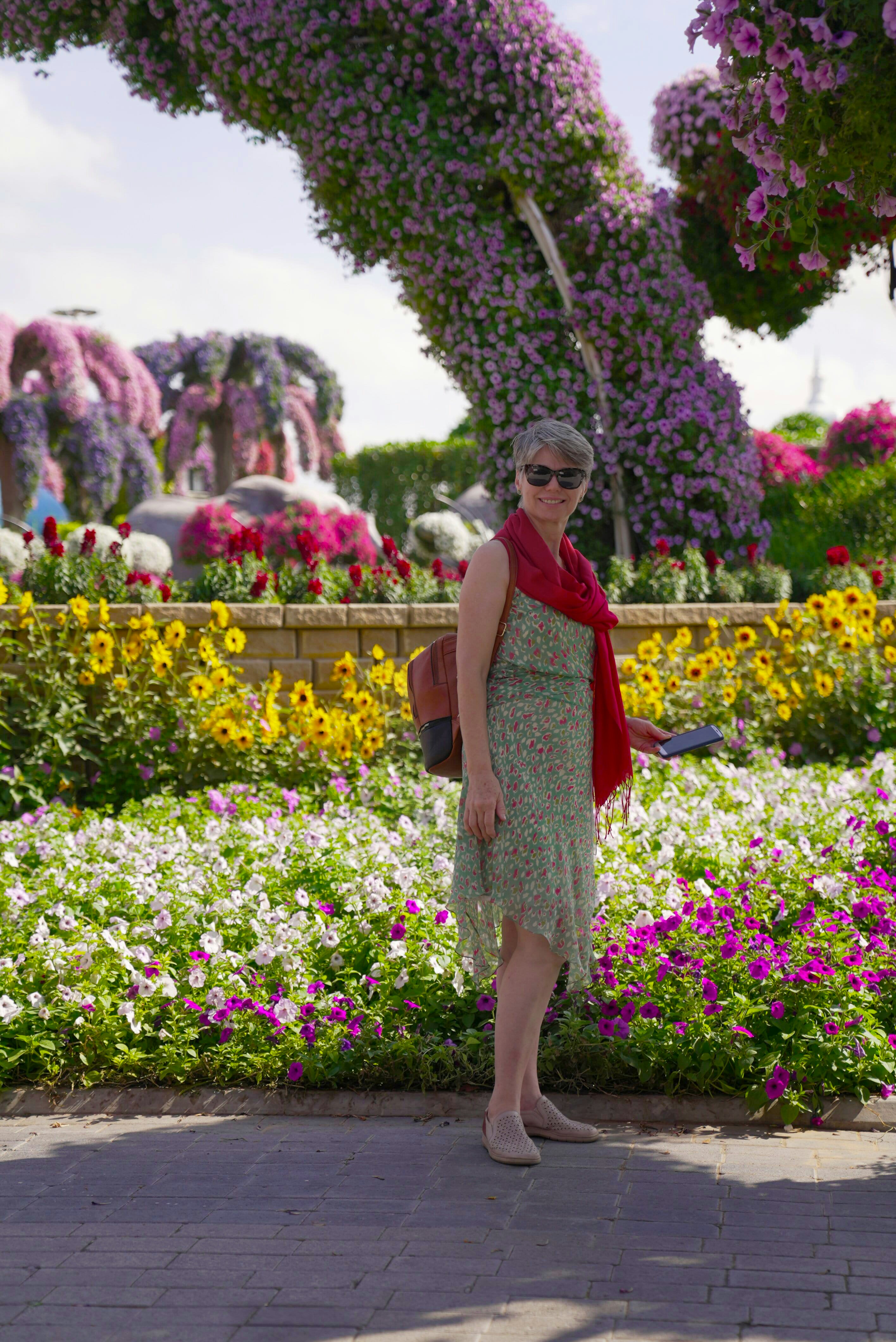 South African woman smiling outdoors in garden surroundings