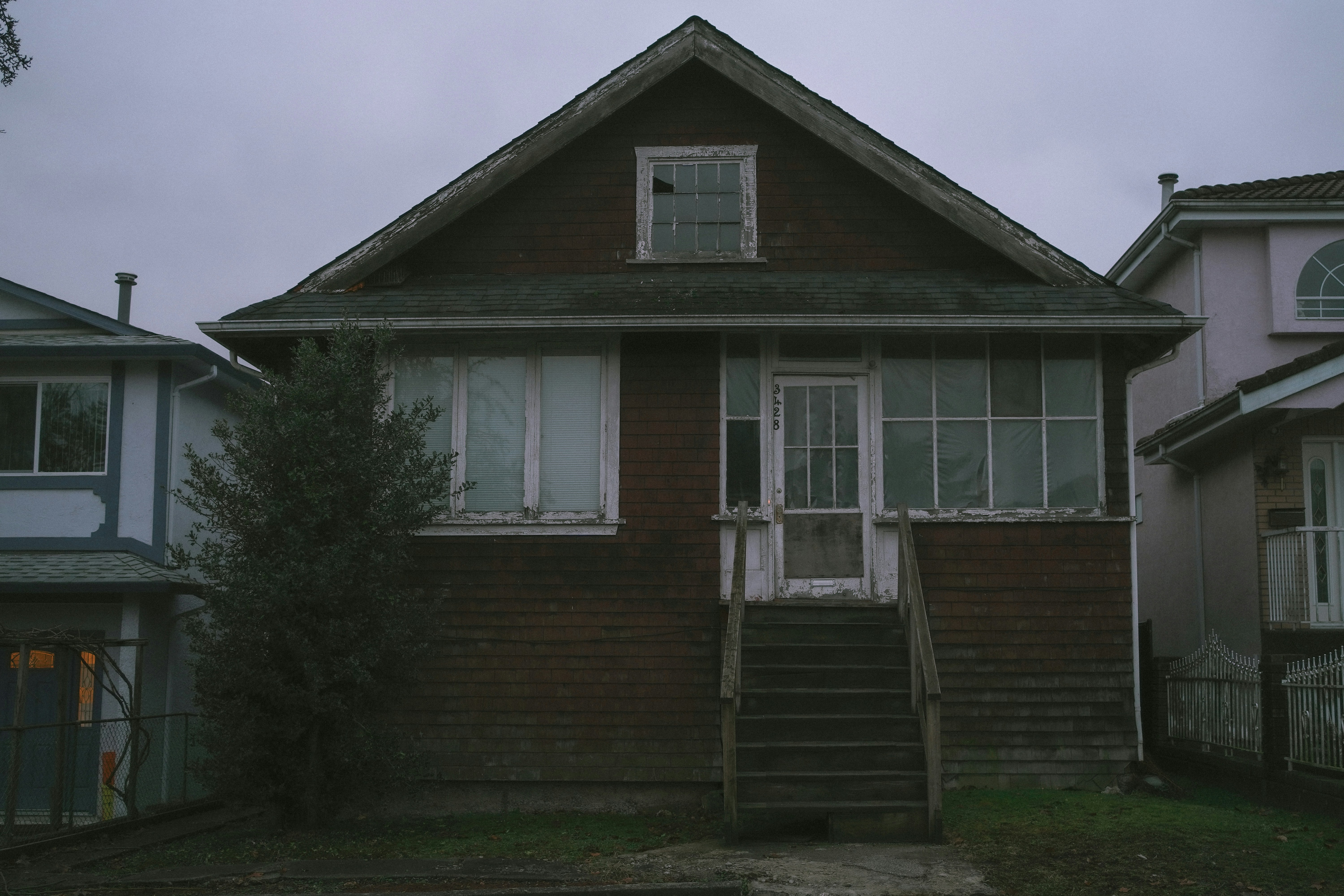 a house with a staircase going up to it