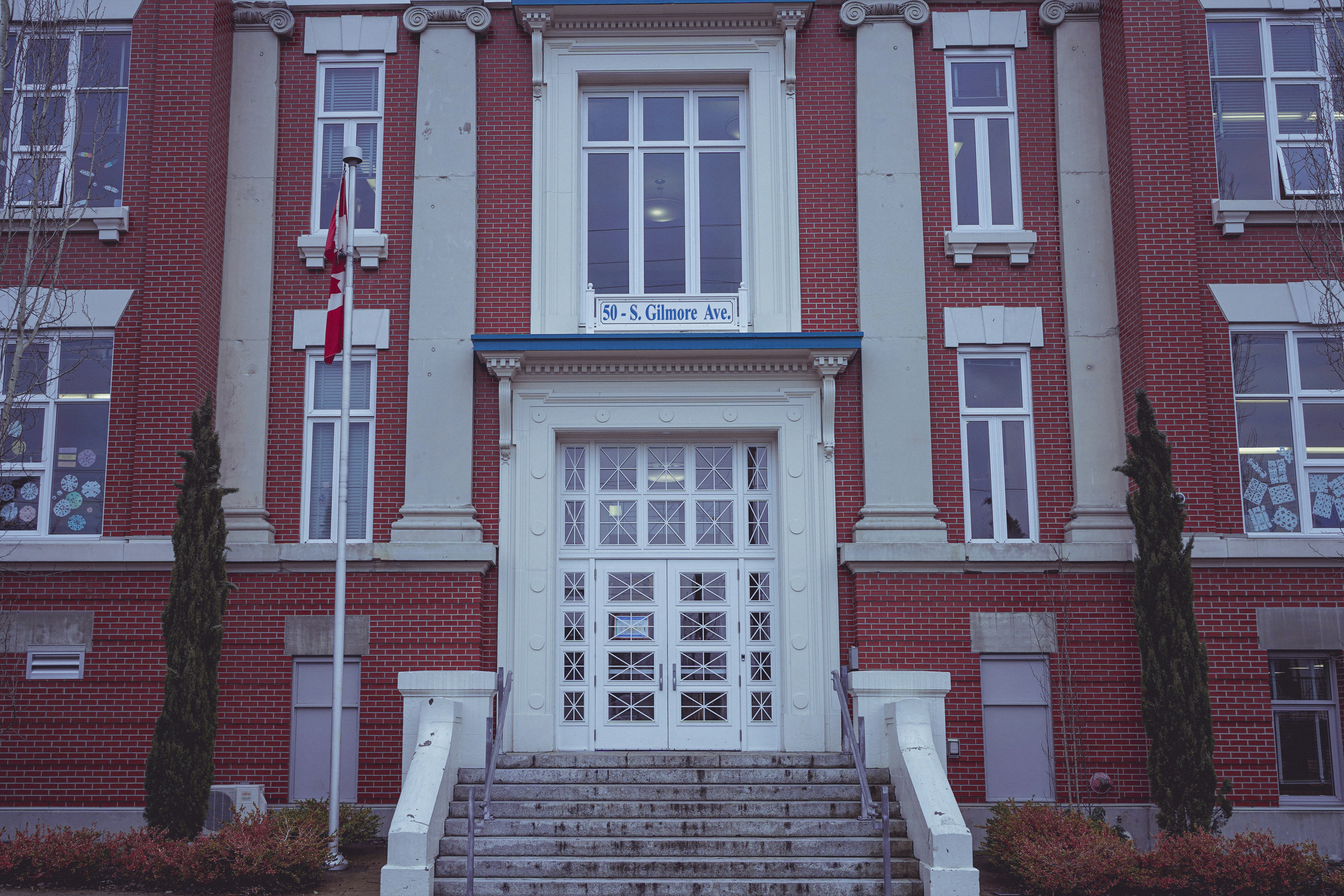 a red brick building with stairs leading up to it