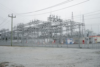 a large building with lots of power lines above it