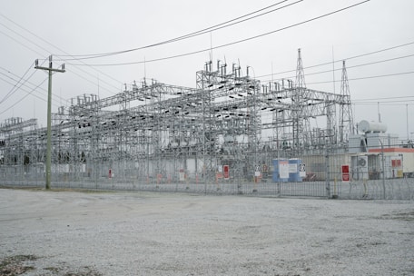a large building with lots of power lines above it