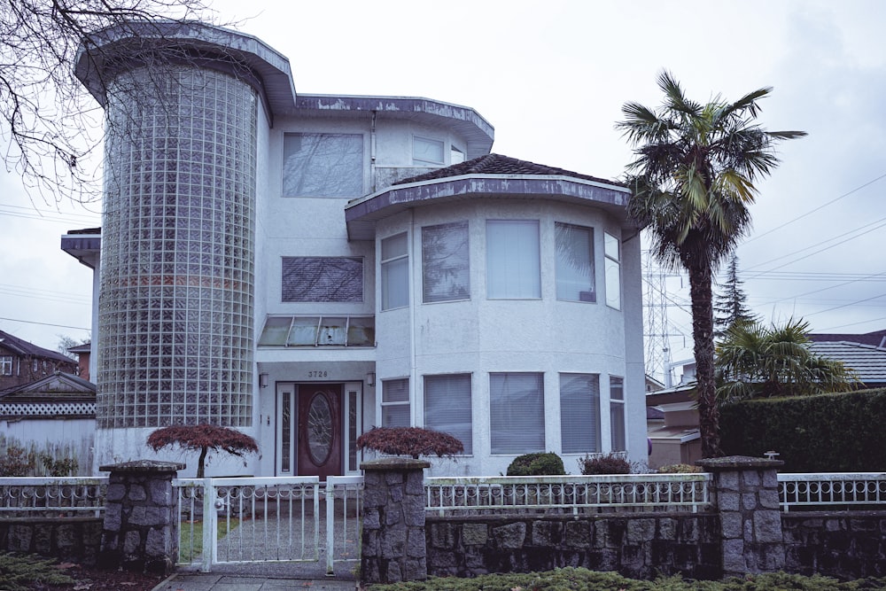 a large white house with a tall tower