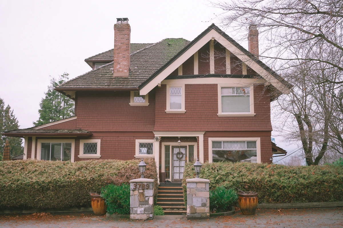 A two-story brown Victorian-era home in Kirkwood, GA.
