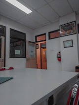 ISO13485 certification plaque displayed prominently in a bright office setting.