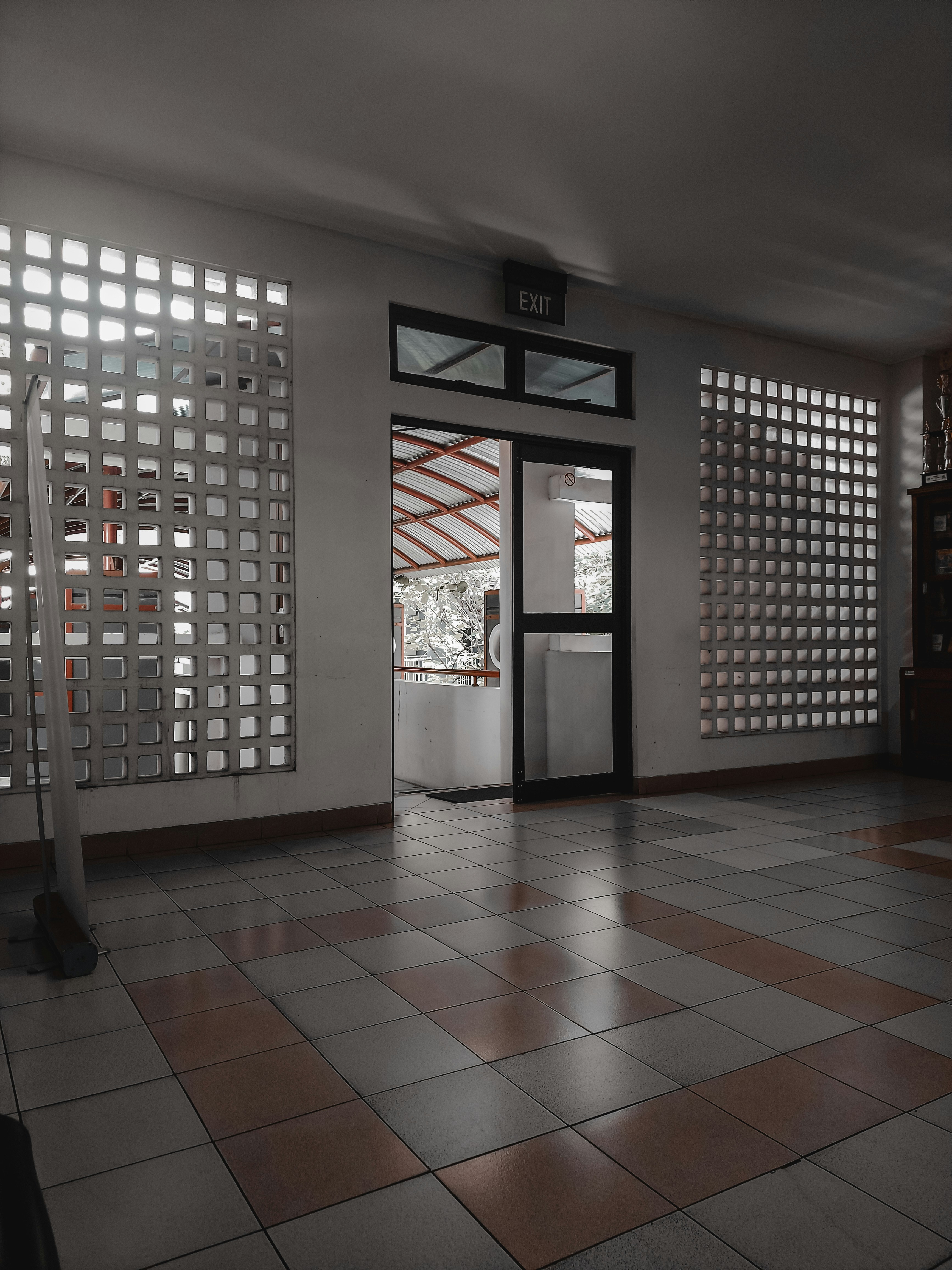 a room with a tiled floor and a door