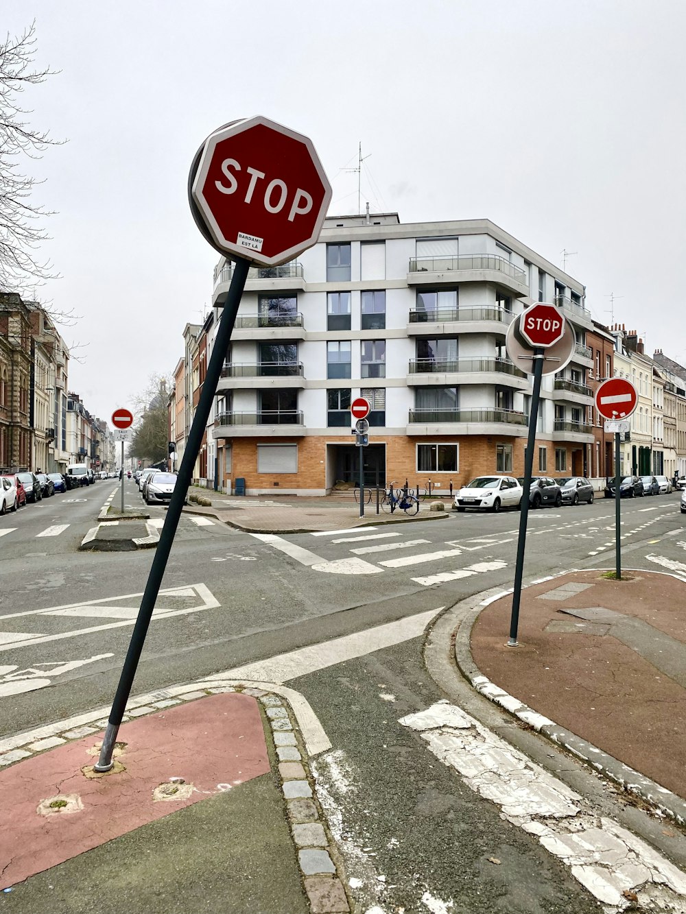 a red stop sign sitting on the side of a road