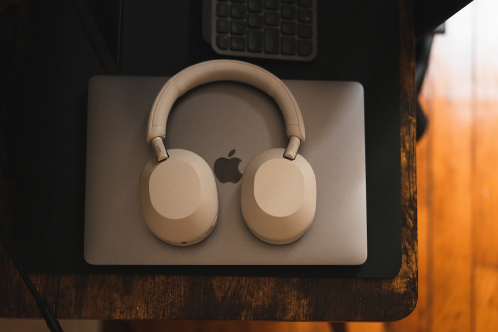 a pair of headphones sitting on top of a mouse pad