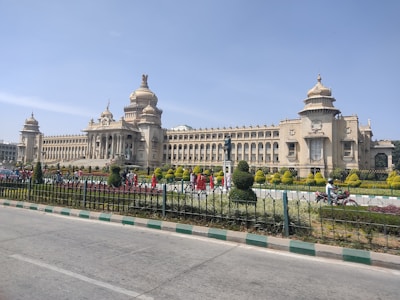 a large building with a fence in front of it
