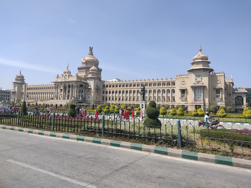 a large building with a fence in front of it