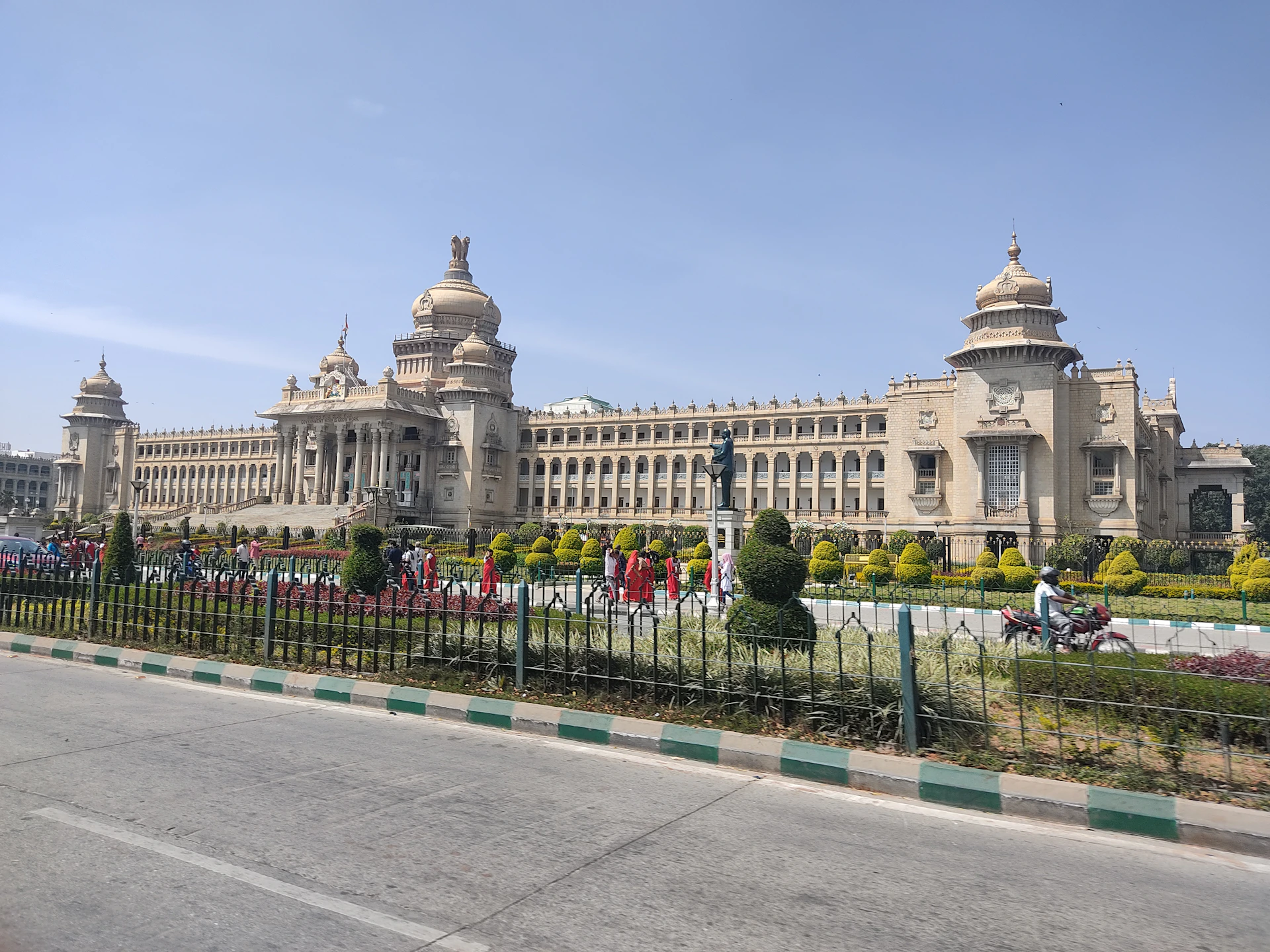 a large building with a fence in front of it