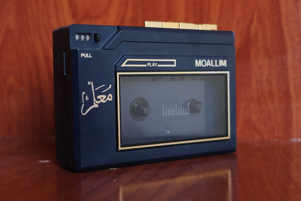 a close up of an old fashioned radio on a table