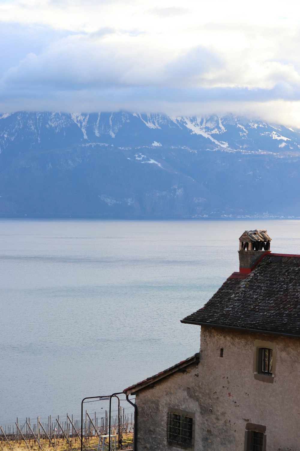 a view of a body of water with mountains in the background