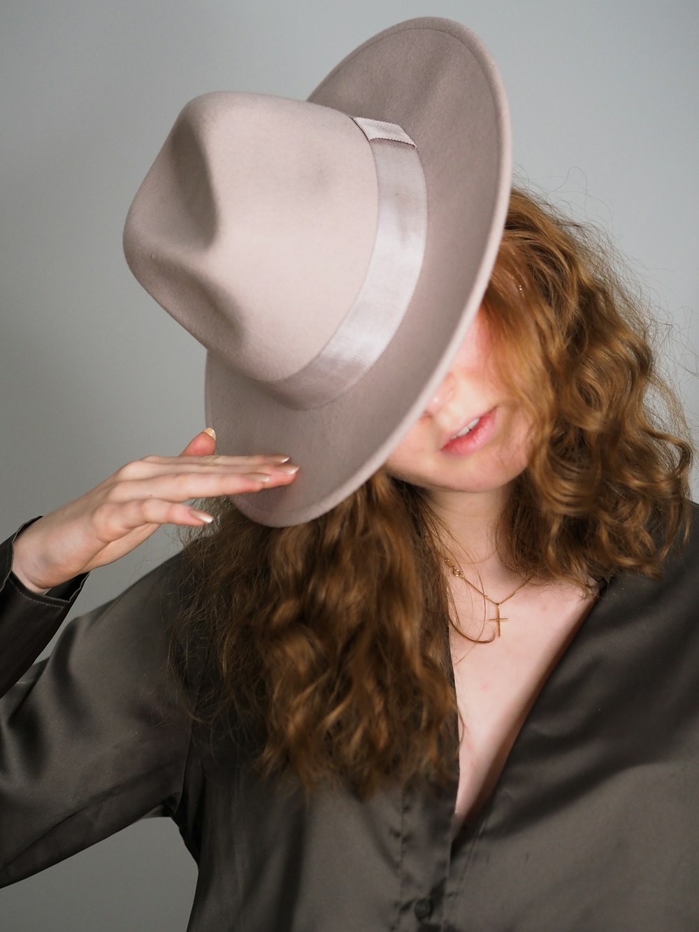 a woman in a black shirt and a white hat