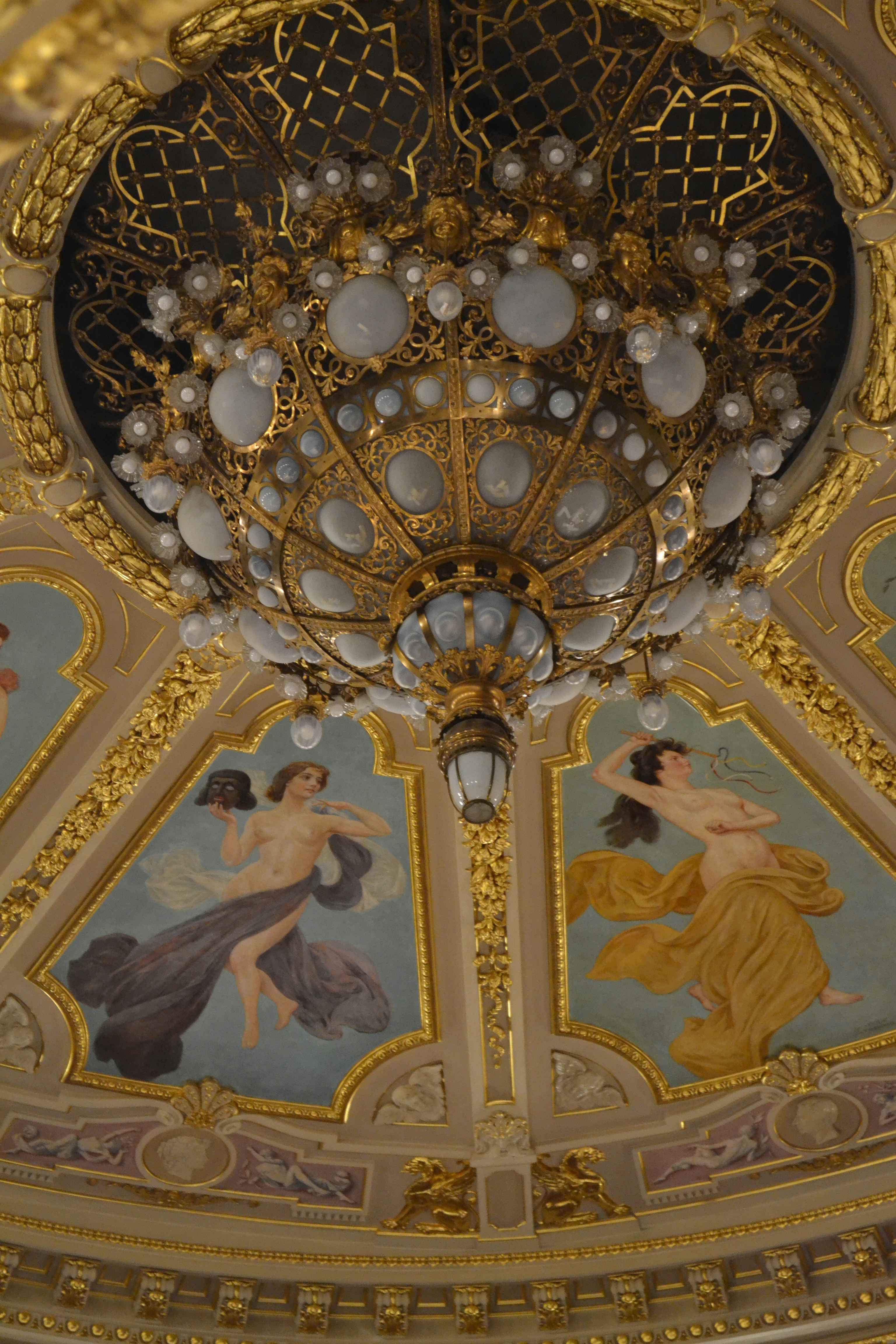 a chandelier hanging from the ceiling of a building