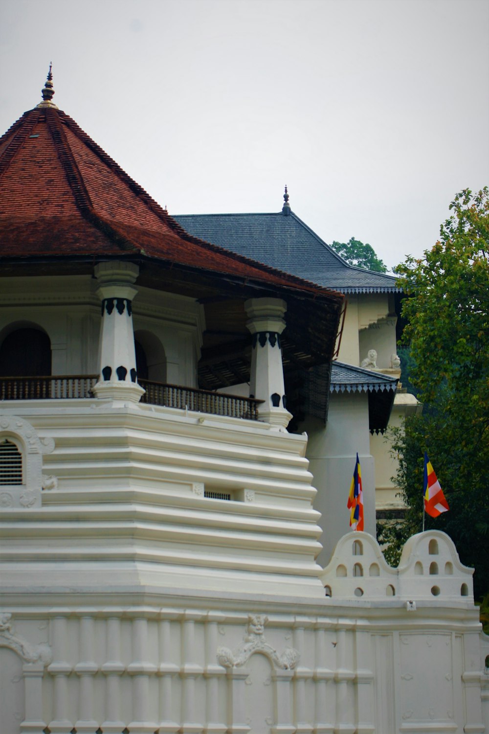 a large white building with a red roof