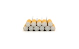 A stack of twelve cigarettes arranged in a pyramid formation with the filters facing forward.