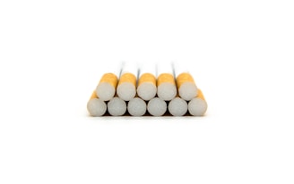 A stack of gold flake cigarette boxes ready for delivery.