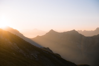 A sunrise over a mountain, symbolizing new beginnings.
