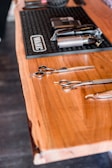 a wooden table topped with lots of different tools