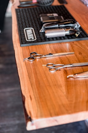 a wooden table topped with lots of different tools