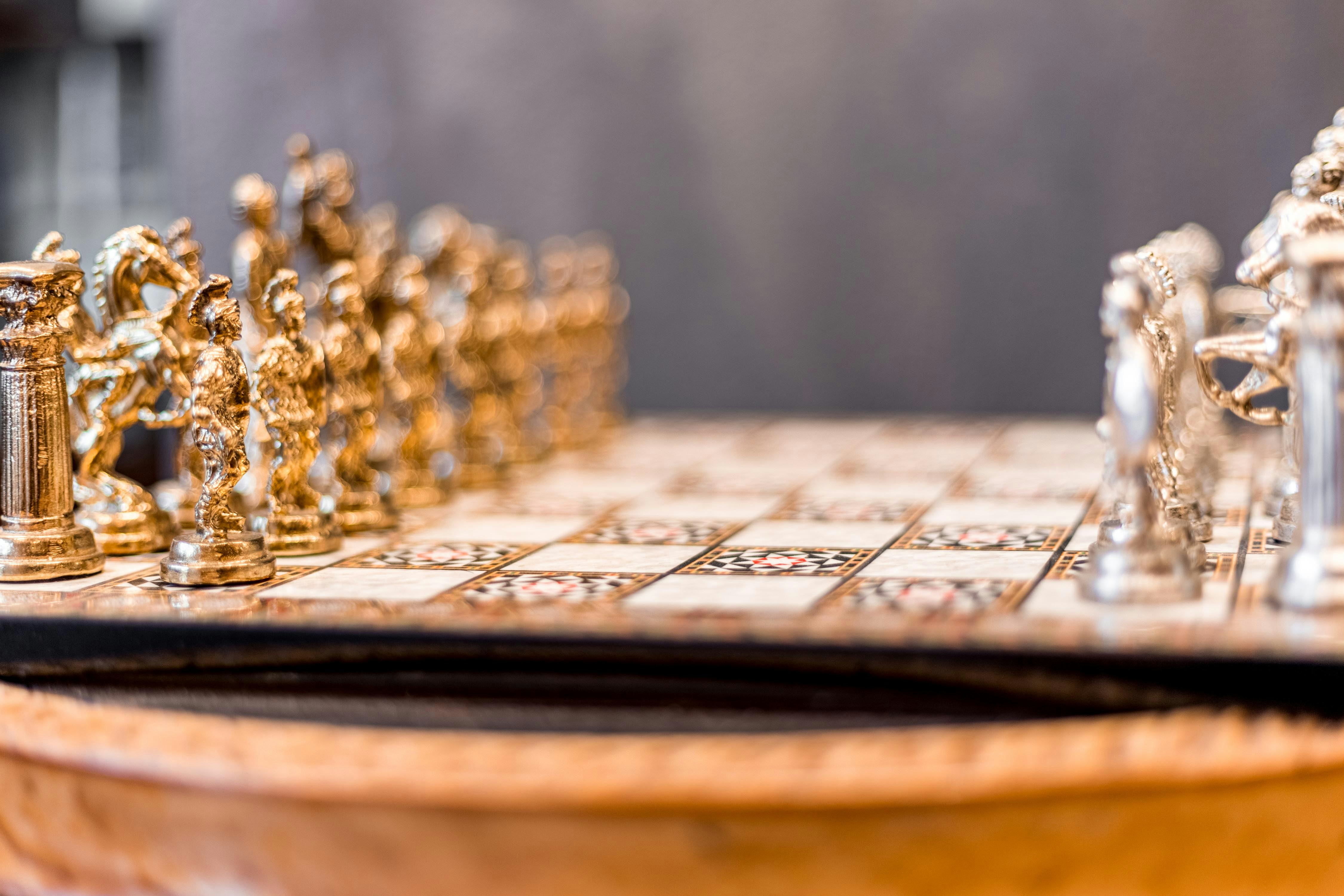 a close up of a chess set on a table