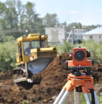 a construction site with a camera on a tripod