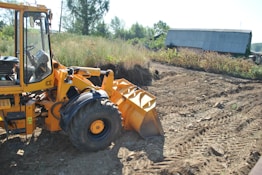 a tractor that is sitting in the dirt