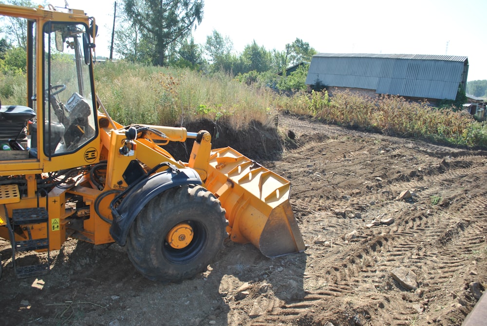 a tractor that is sitting in the dirt