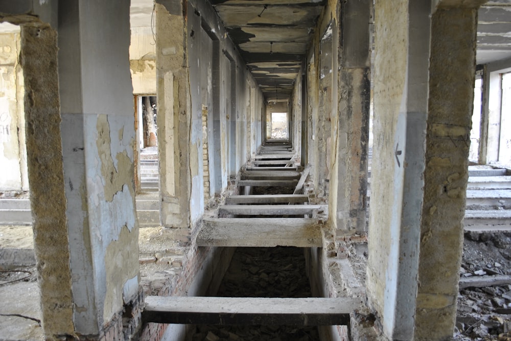 a row of benches in a run down building