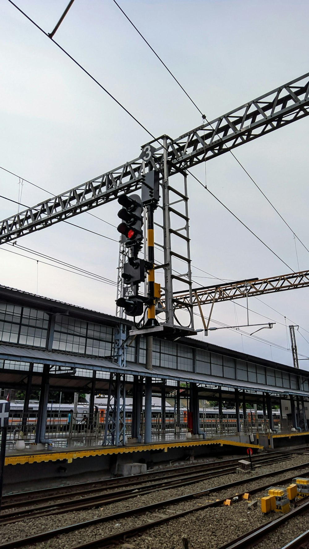 a train station with a train on the tracks