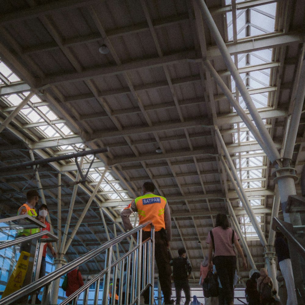 a group of people that are walking up some stairs