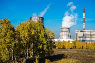 a factory with smoke coming out of it's stacks